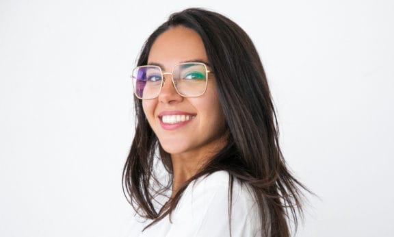 Woman with large glasses on smiling