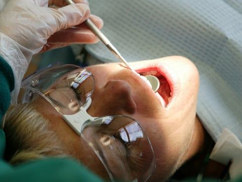 Dentist looking in a woman